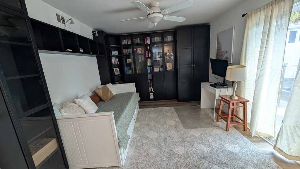 Guest room with pull out IKEA trundle. And lots of books!