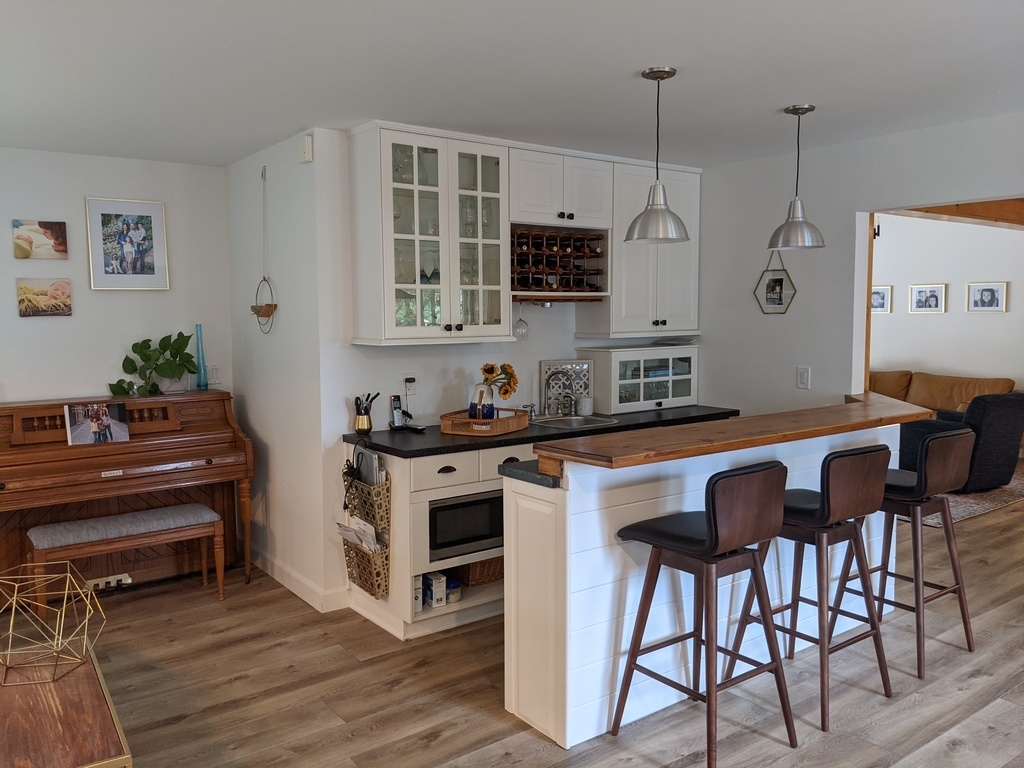 Wet bar with mini fridge.