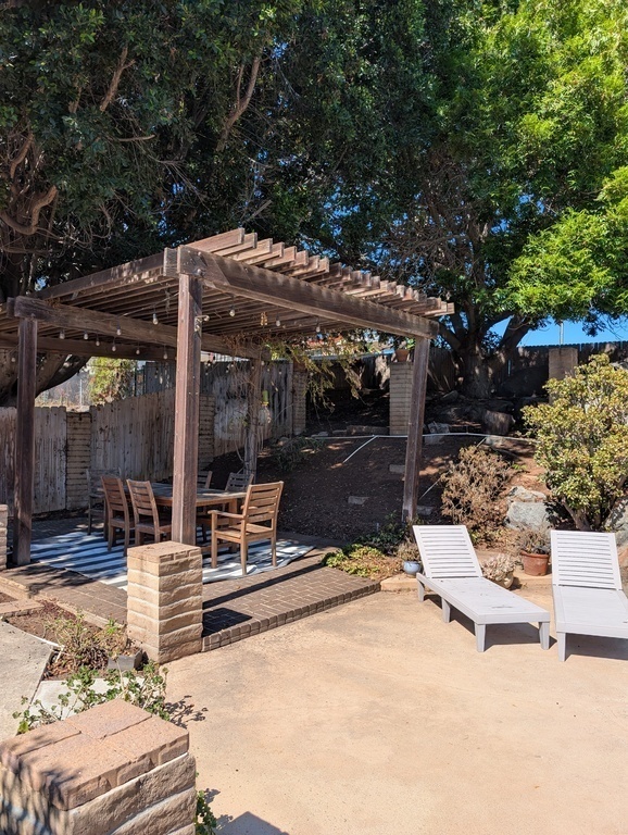 Exterior dining area by the pool.
