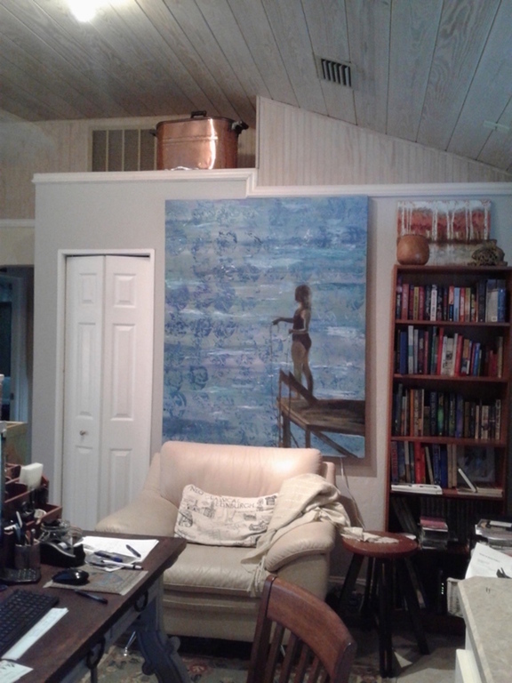 A tucked-away desk office with computer and wifi