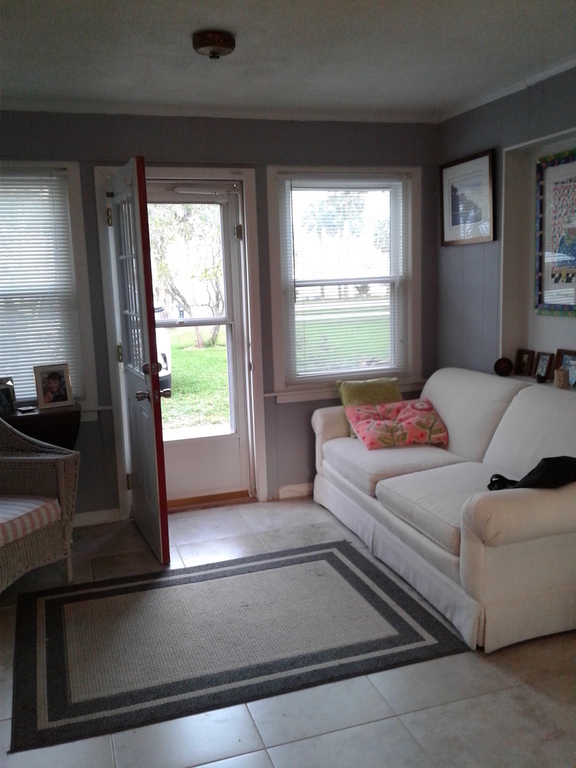 Enter our home through the "Sunroom" and feel a calmness over take you...