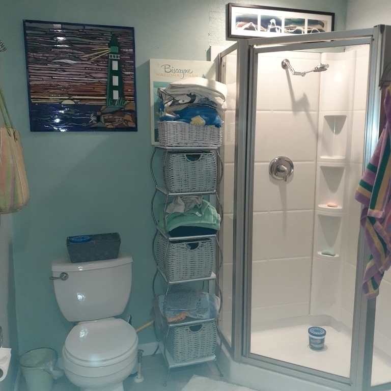 Second washroom adjacent to small bedroom, has wc, shower and laundry