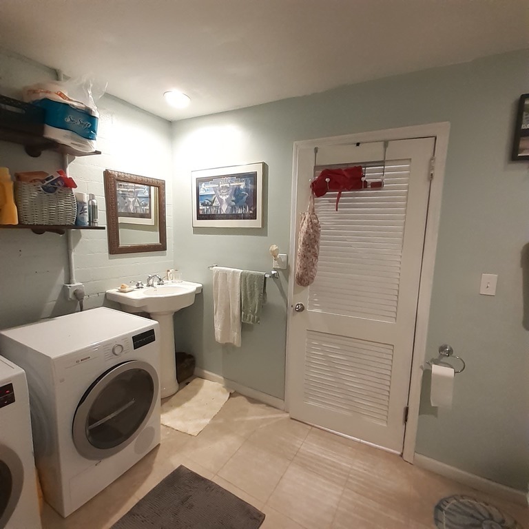 Second bath /Laundry also has access to backyard.