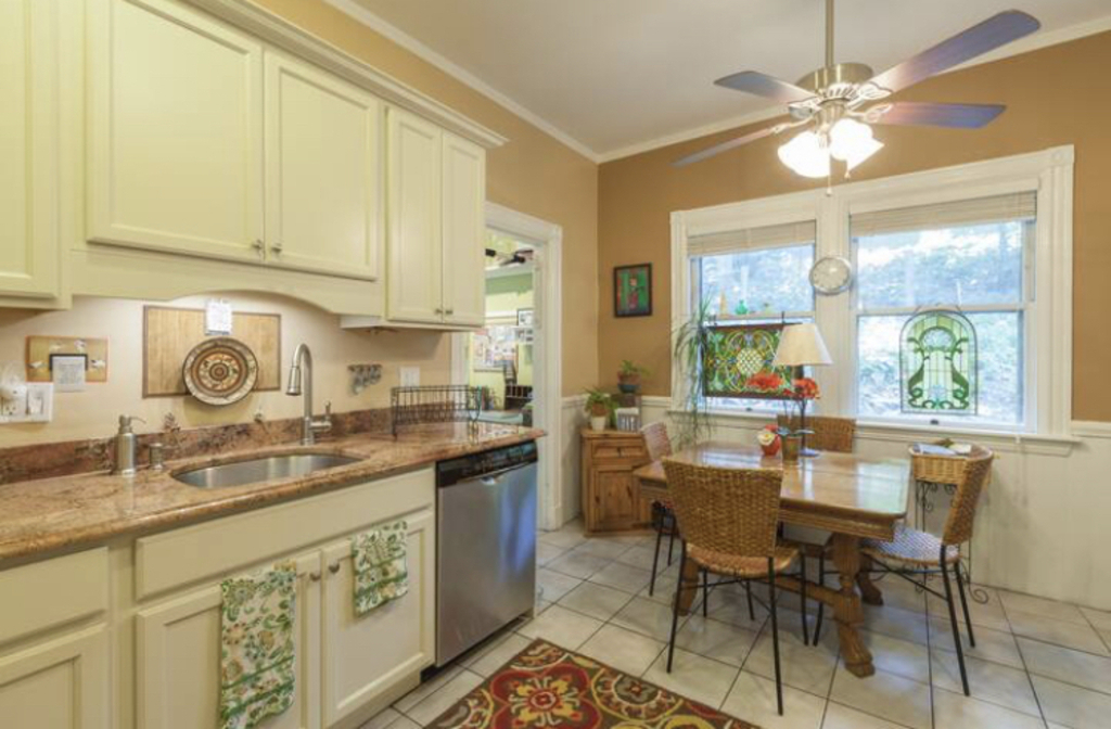 Kitchen with study (small desk).  Microwave, oven, gas stove and dishwasher.