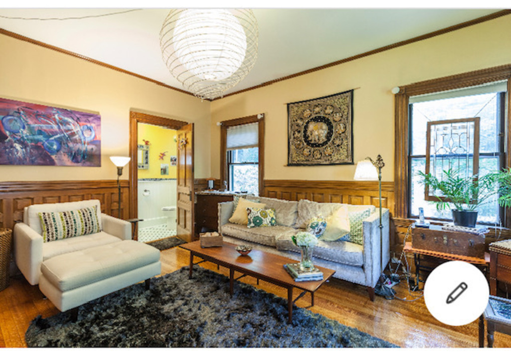 Living room with daybed and 1/2 bath (toilet and sink)