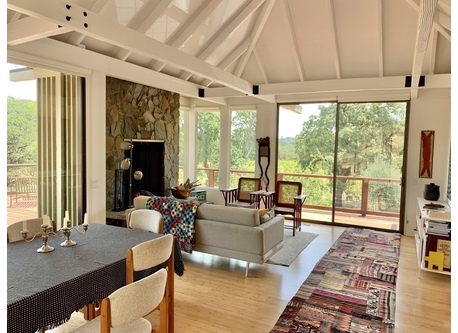 The great room of the house combines Living, Dining, and Kitchen areas, with wonderful views 