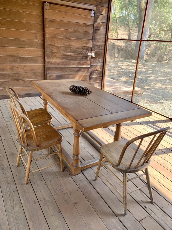 There are 3 distinct areas for outdoor dining & entertaining. This is the Pumphouse screen porch.