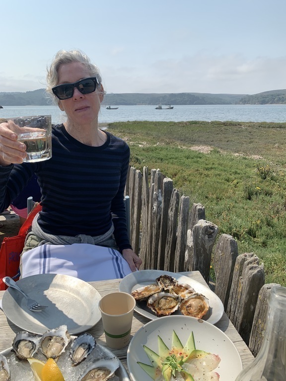 Kitty toasts the glorious landscape of Tomales Bay, 50 minutes from Glen Ellen