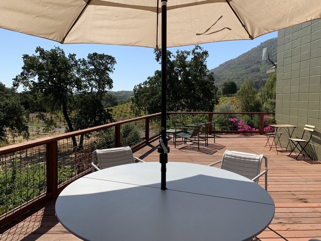 There are 3 distinct areas for outdoor dining & entertaining. This is the 1,000-square-foot (90-square-meter) main deck.