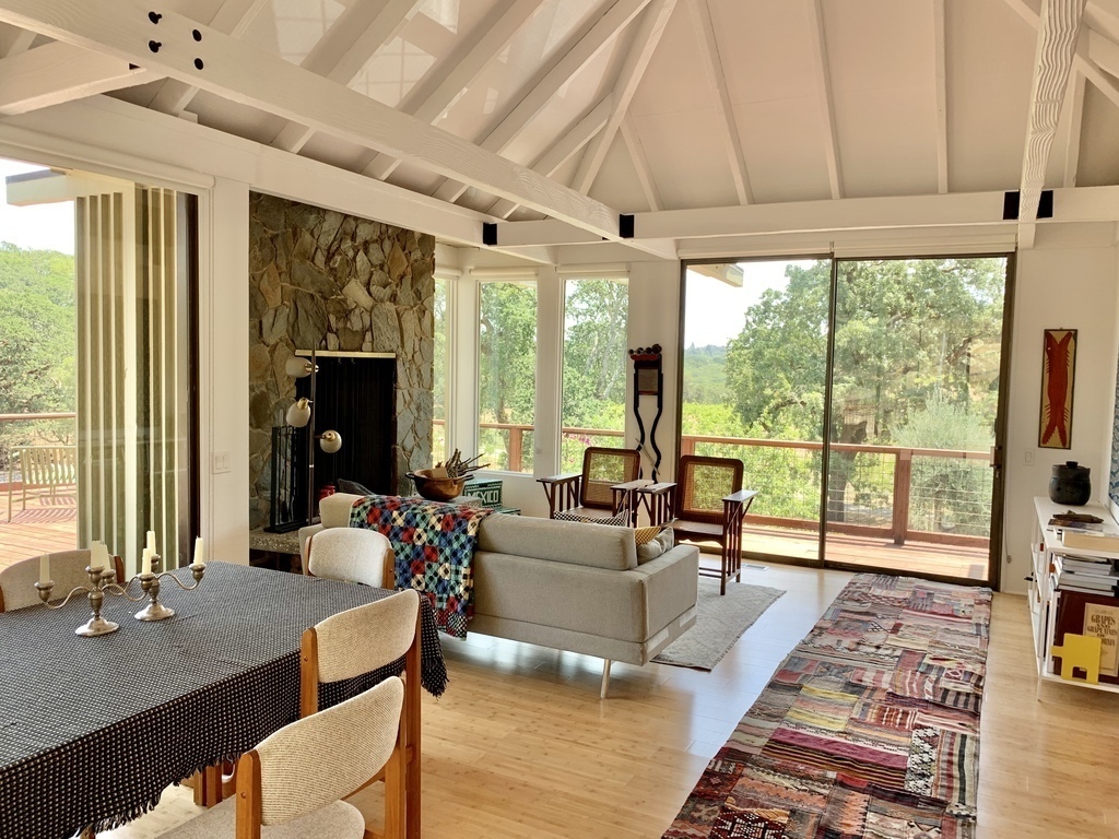 The great room of the house combines Living, Dining, and Kitchen areas, with wonderful views 