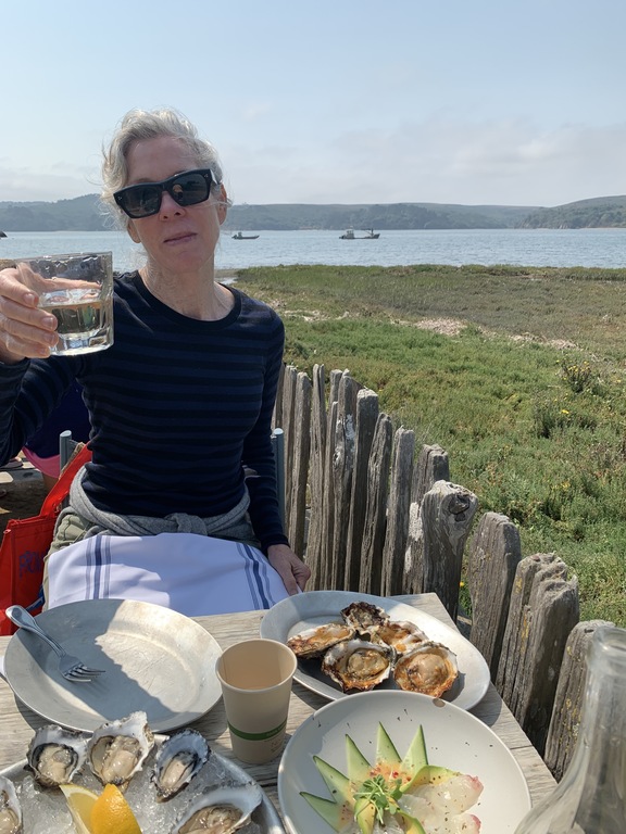 Kitty toasts the glorious landscape of Tomales Bay, 50 minutes from Glen Ellen