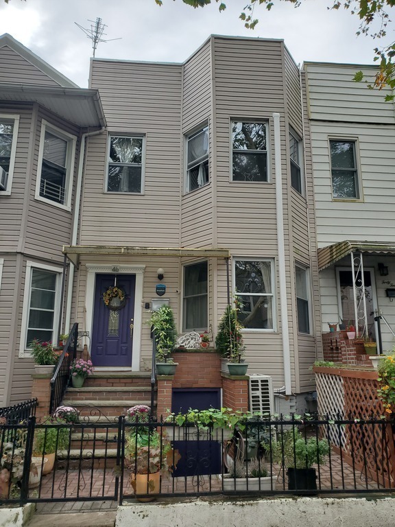 Our house is one of many along a quiet street.