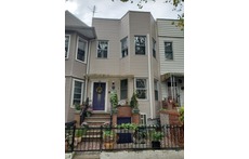 Our house is one of many along a quiet street.