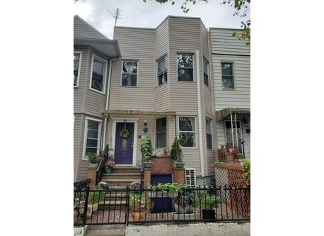 Our house is one of many along a quiet street.