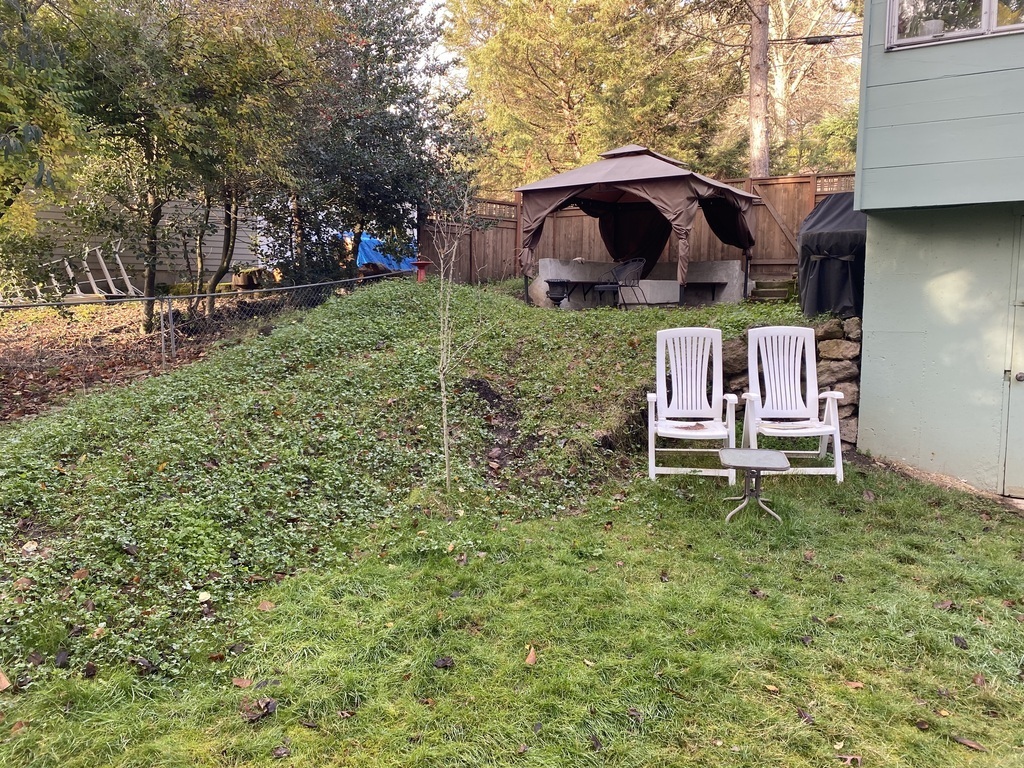 The small rise leading to the side patio