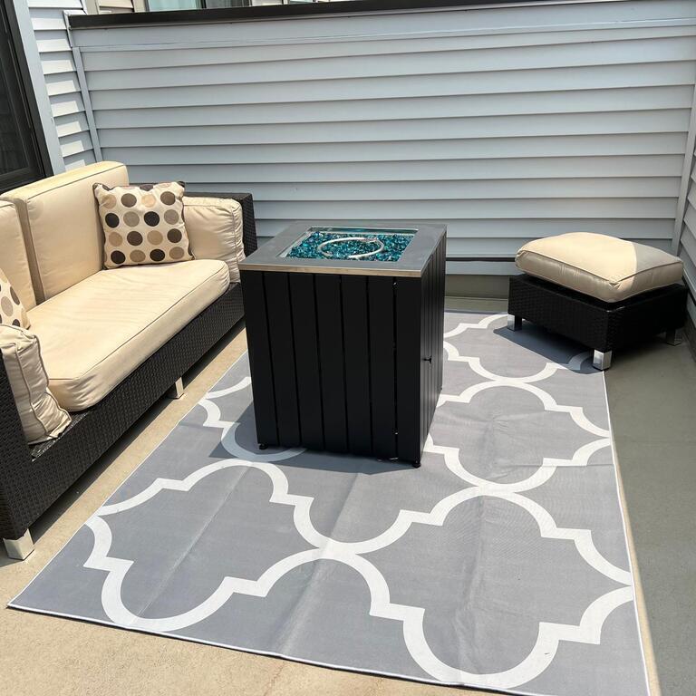 Terrace with gas fire pit and umbrella