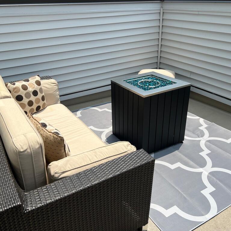 Terrace with gas fire pit and umbrella