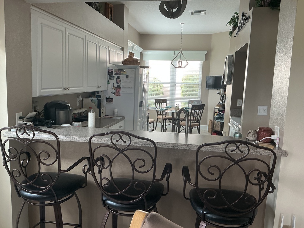 Kitchen bar and view through Kitchen