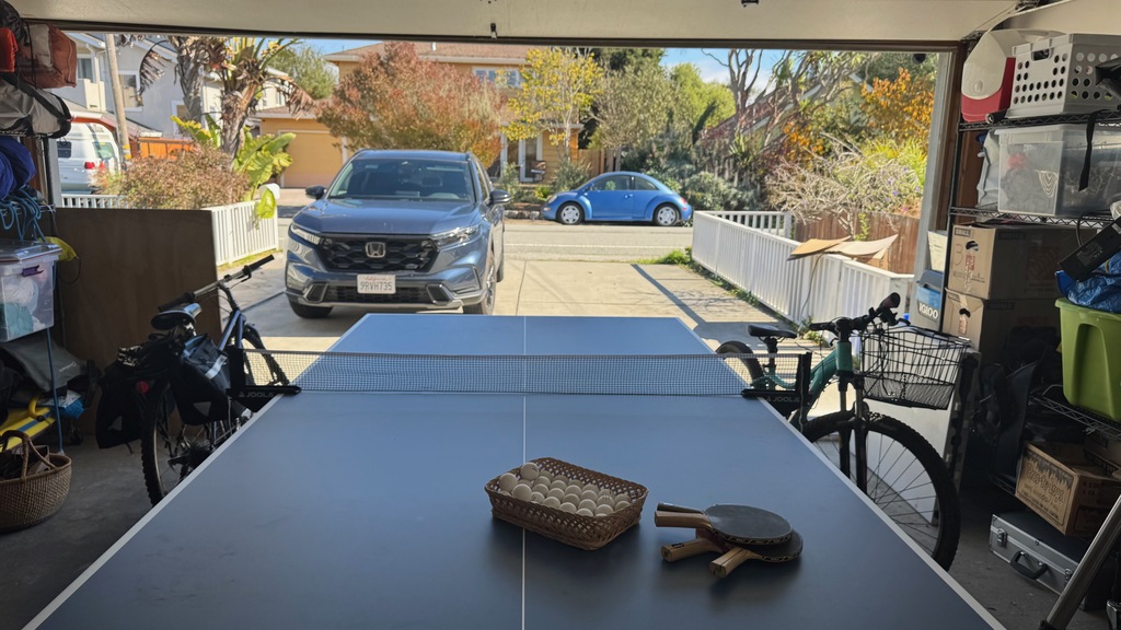 2 parking spaces outside of garage.  Garage has exercise equipment, ping pong table and bikes.