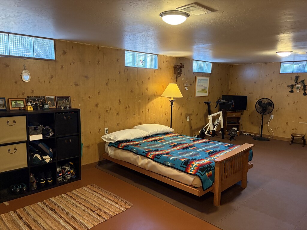 Basement with futon and workout space
