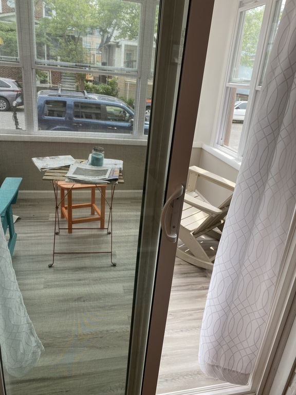 Our front porch is fully enclosed, with a space heater making it a four season room.