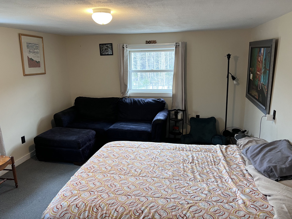 Bedroom one.  Has Queen bed, and love seat.  One closet and 2 dressers.  