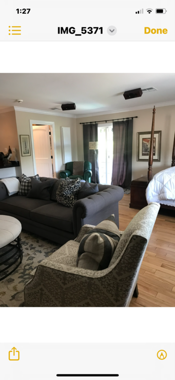 A view in the flat, the door on the left is the entry to the bath.  The large drapes on the left is the balcony access.  Chai...