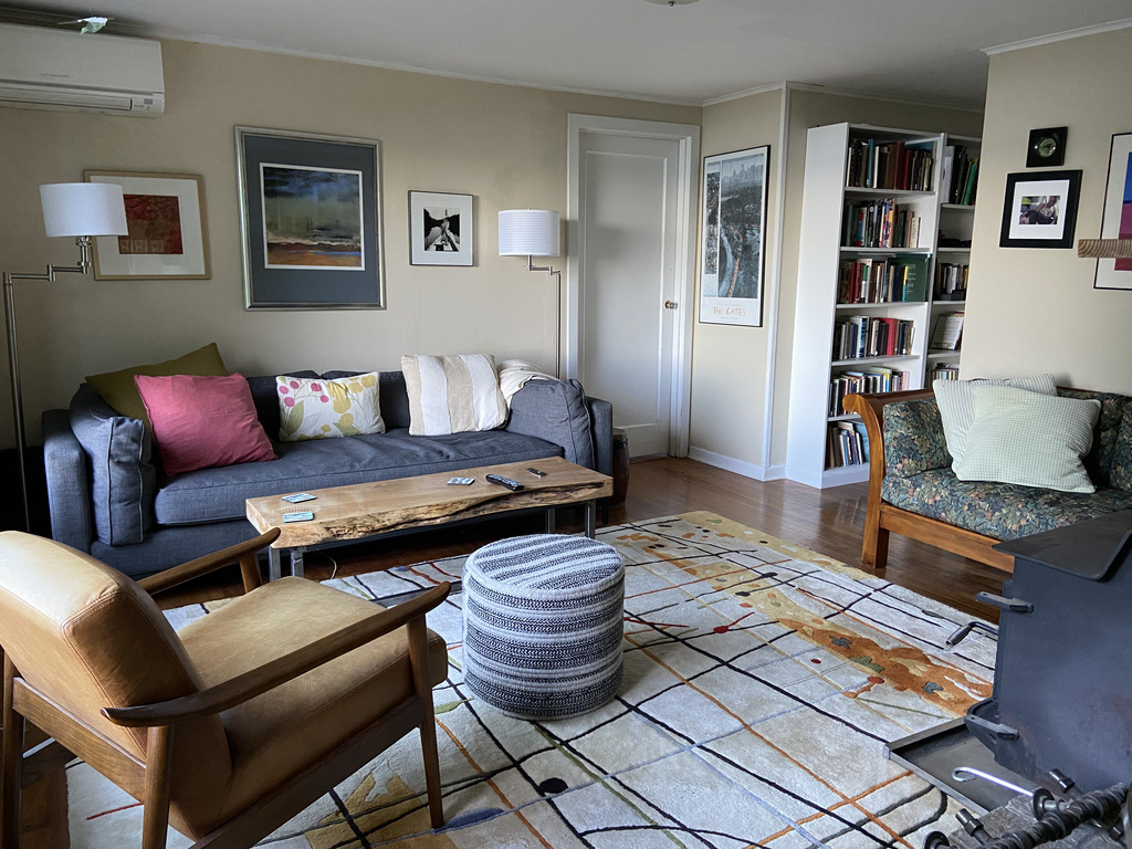 Downstairs living room with bedroom door.