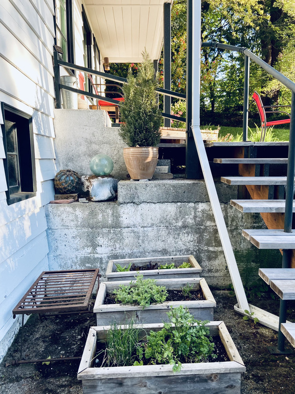 There are steps from the driveway up to the front door.