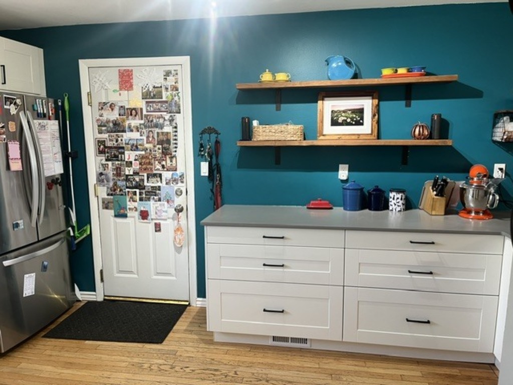 Kitchen counter and pedestrian door to garage and back yard