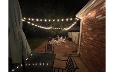 Stone patio with wood firepit