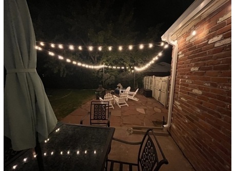 Stone patio with wood firepit
