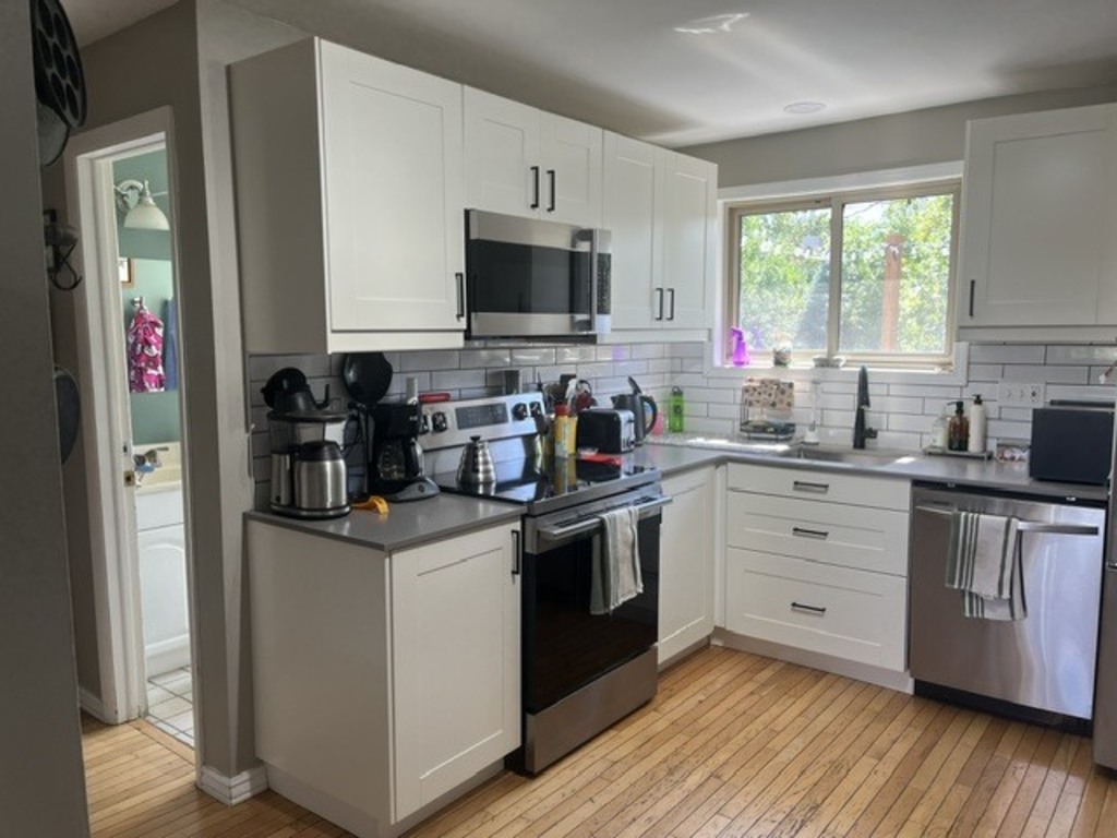 Kitchen with stove and coffee bar
