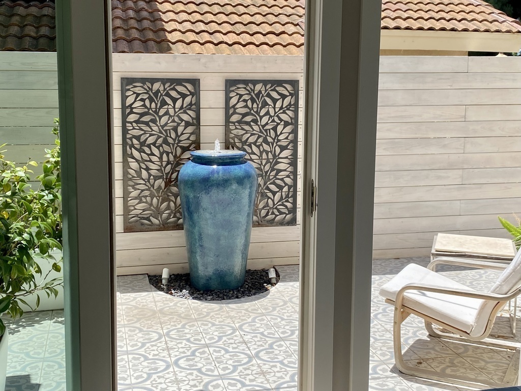 Small patio and fountain off the dining area.