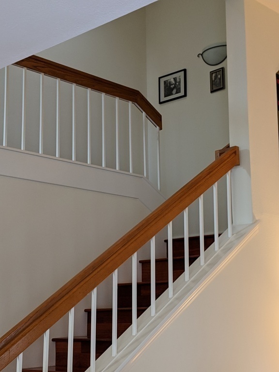 Stairs to the bedrooms and two bathrooms