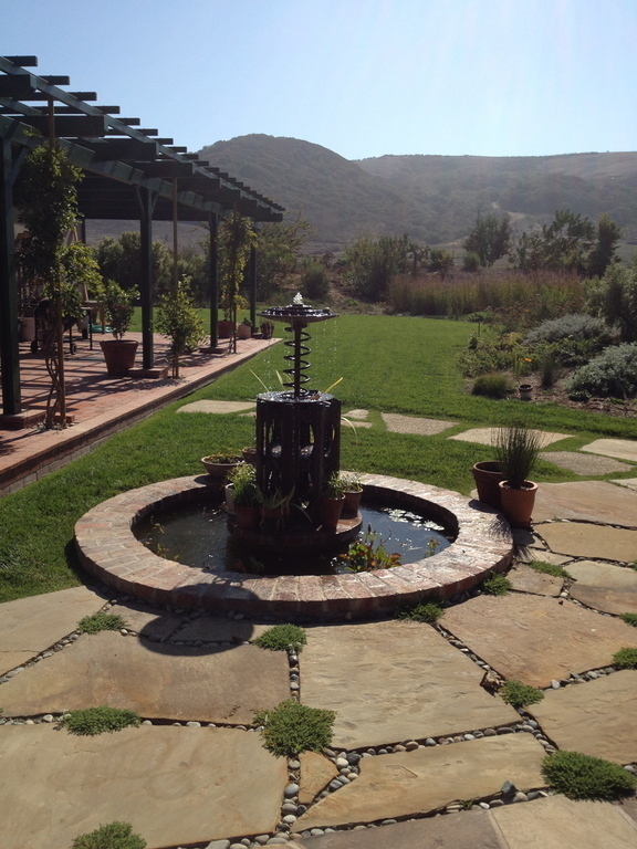 water fountain made of old tractor parts!