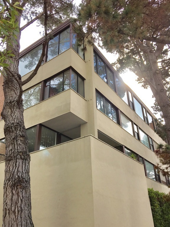 The large (160-square-meter), 3 bedroom, 2 bath apartment is on the top floor of a mid-20th century Modern building.