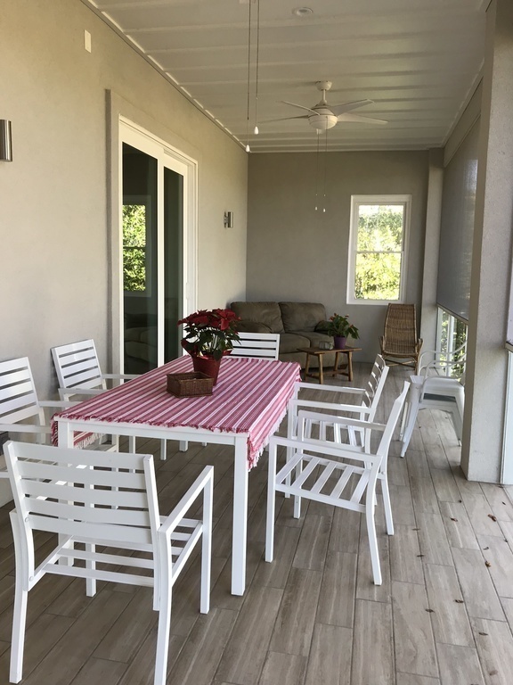 Eating area on upstairs  screened-in deck
