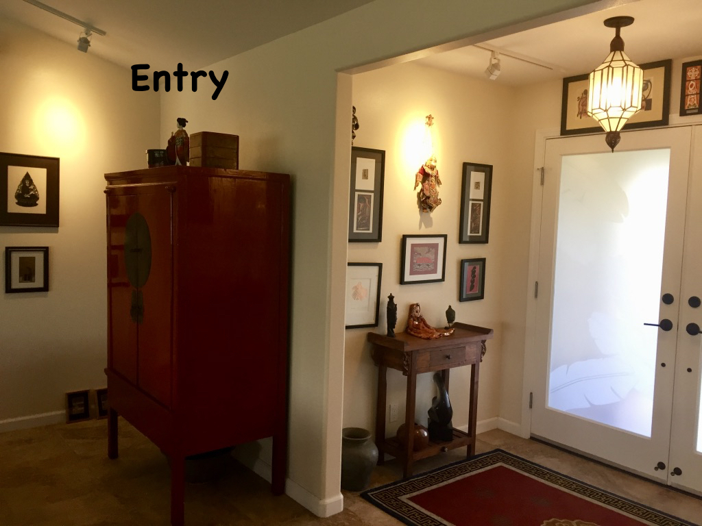 The front entry if filled with travel souvenirs