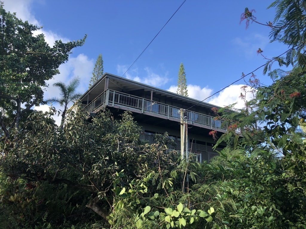 From the street - the house is high with an ocean view