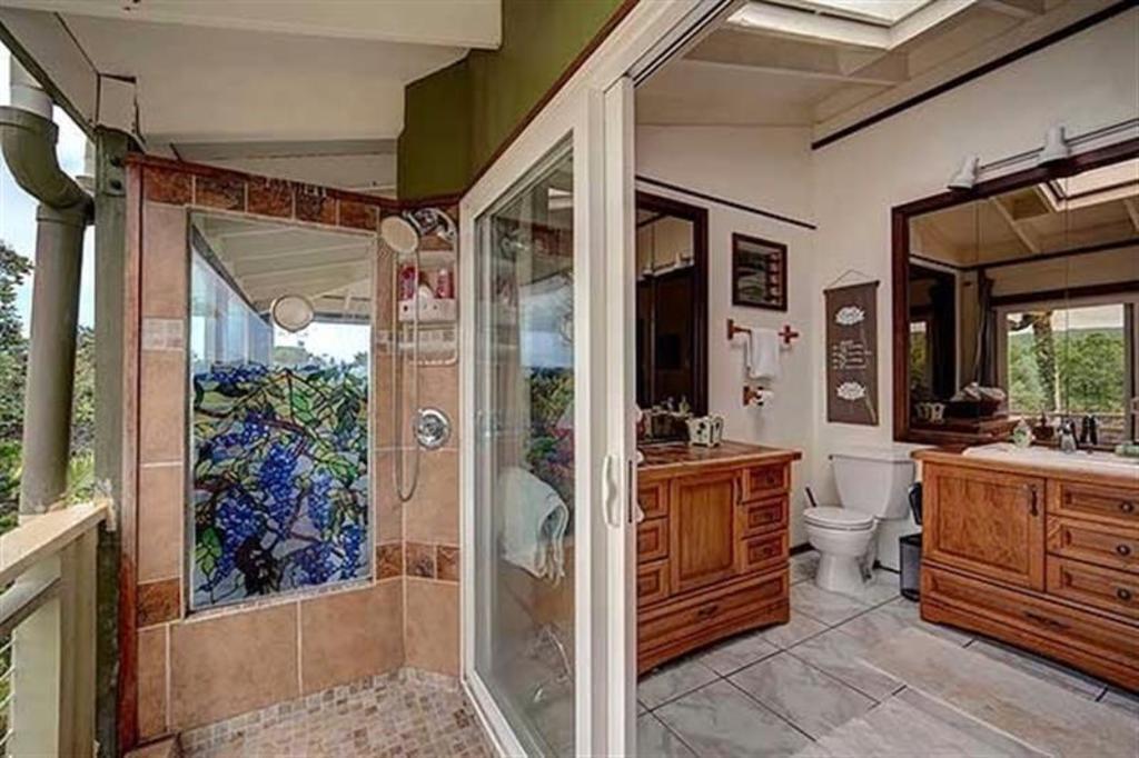 Bathroom has outdoor shower.