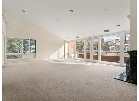 Living/Dining room with balcony overlooking "The Castle" and Jamaica Pond
