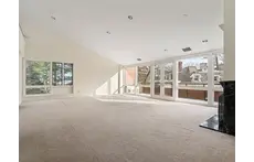 Living/Dining room with balcony overlooking "The Castle" and Jamaica Pond