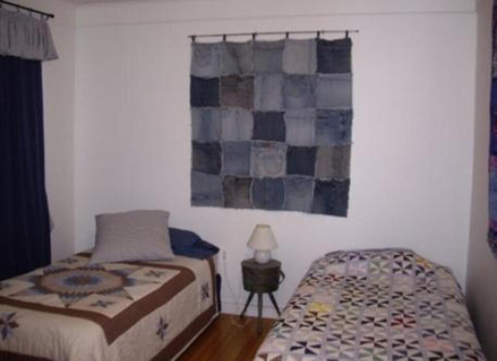 Children's room with porta-crib and many toys. 