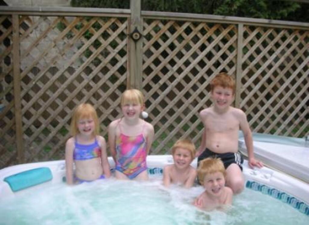 Hot tub with nieces and nephew