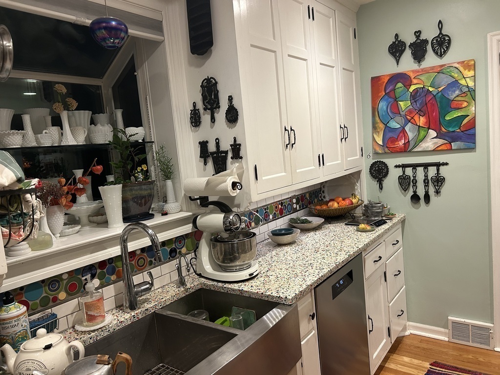 On the kitchen wall, Susan is the painter.