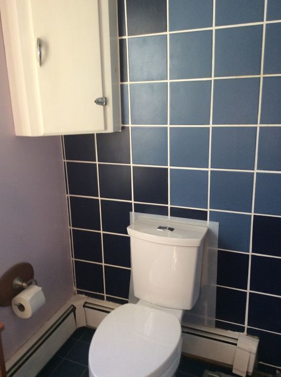 series of bathroom, with newly tiled floor and walls