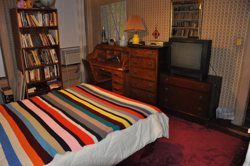 guestroom with queen-sized bed and television, third floor