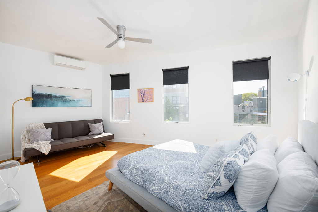 Futon + Queen Sized Bed in Bedroom