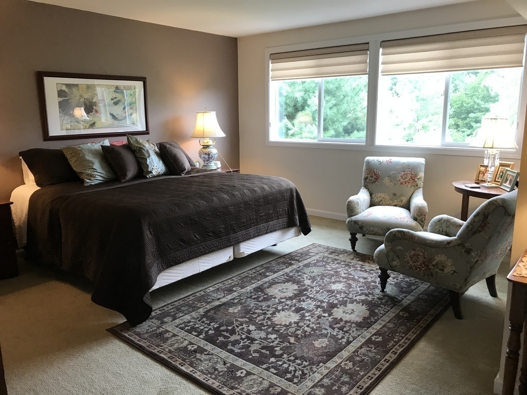 Master bedroom en suite with view over pond and large walk in closet